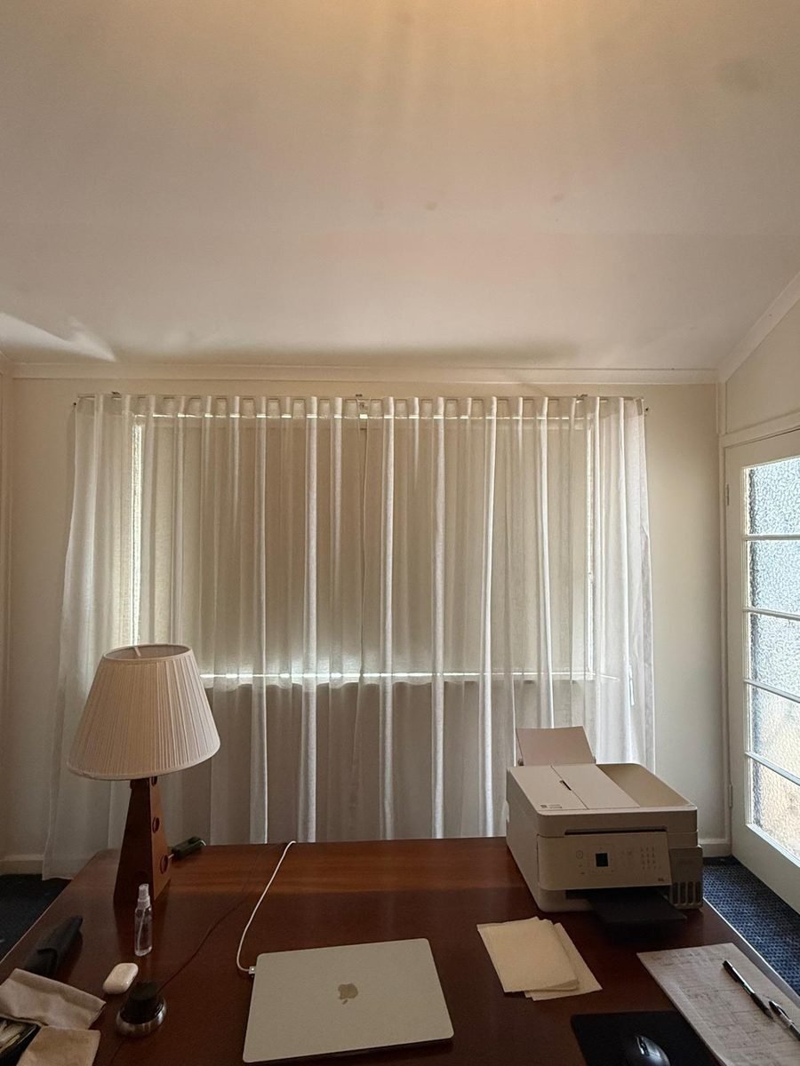 Sheer curtains installed in a Perth home office