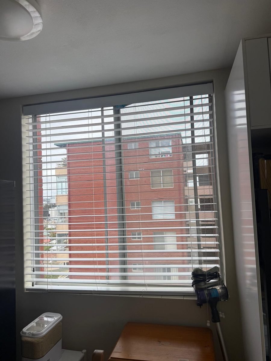 White venetian blinds on a window in a Perth apartment