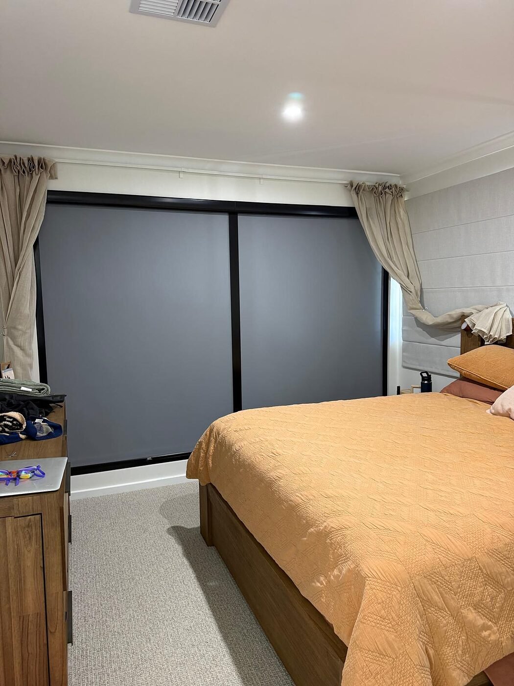Blockout roller blind fitted to a bedroom sliding door in a Perth home