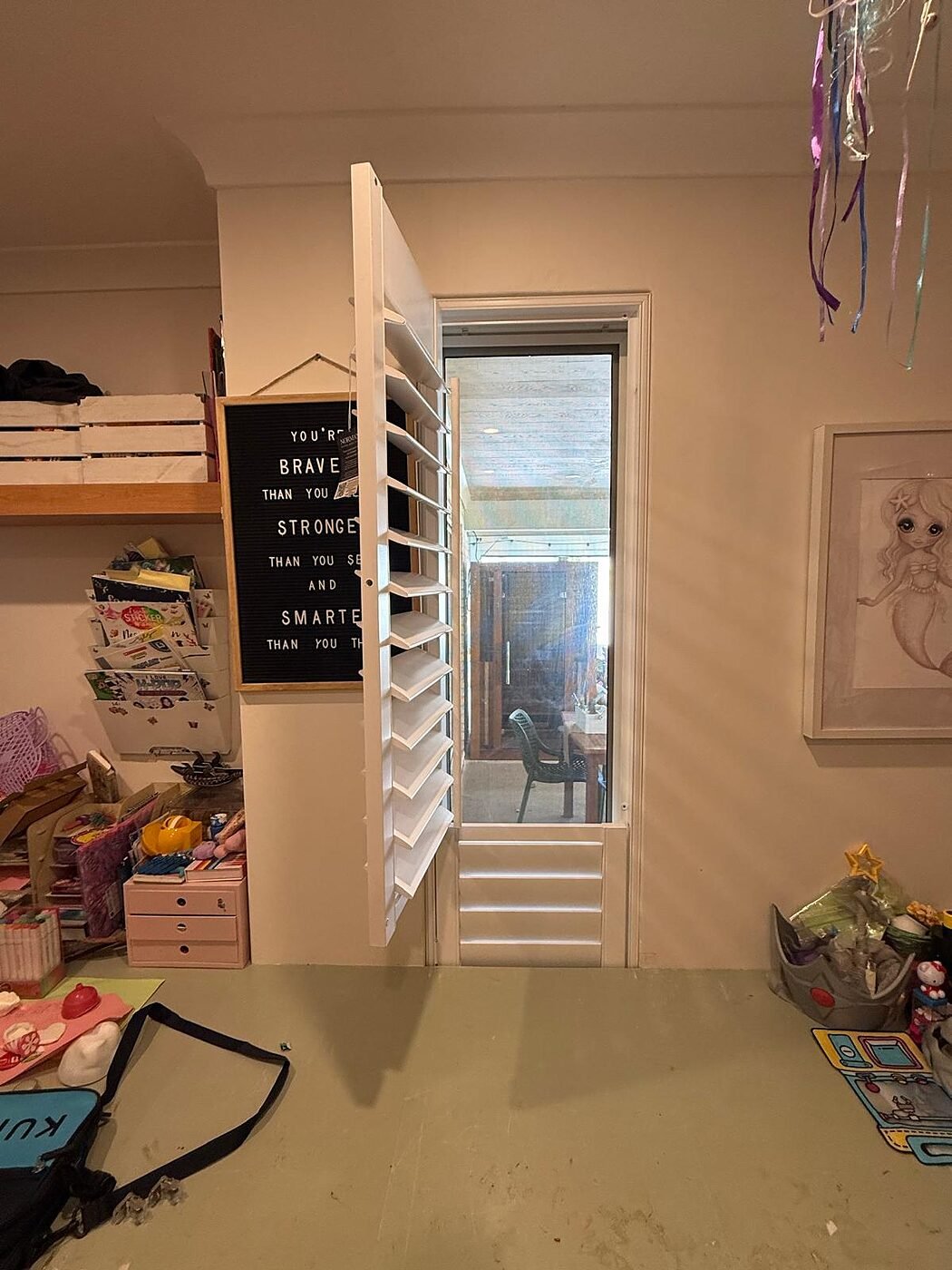 White plantation shutters fitted to a narrow study nook window in a Perth home
