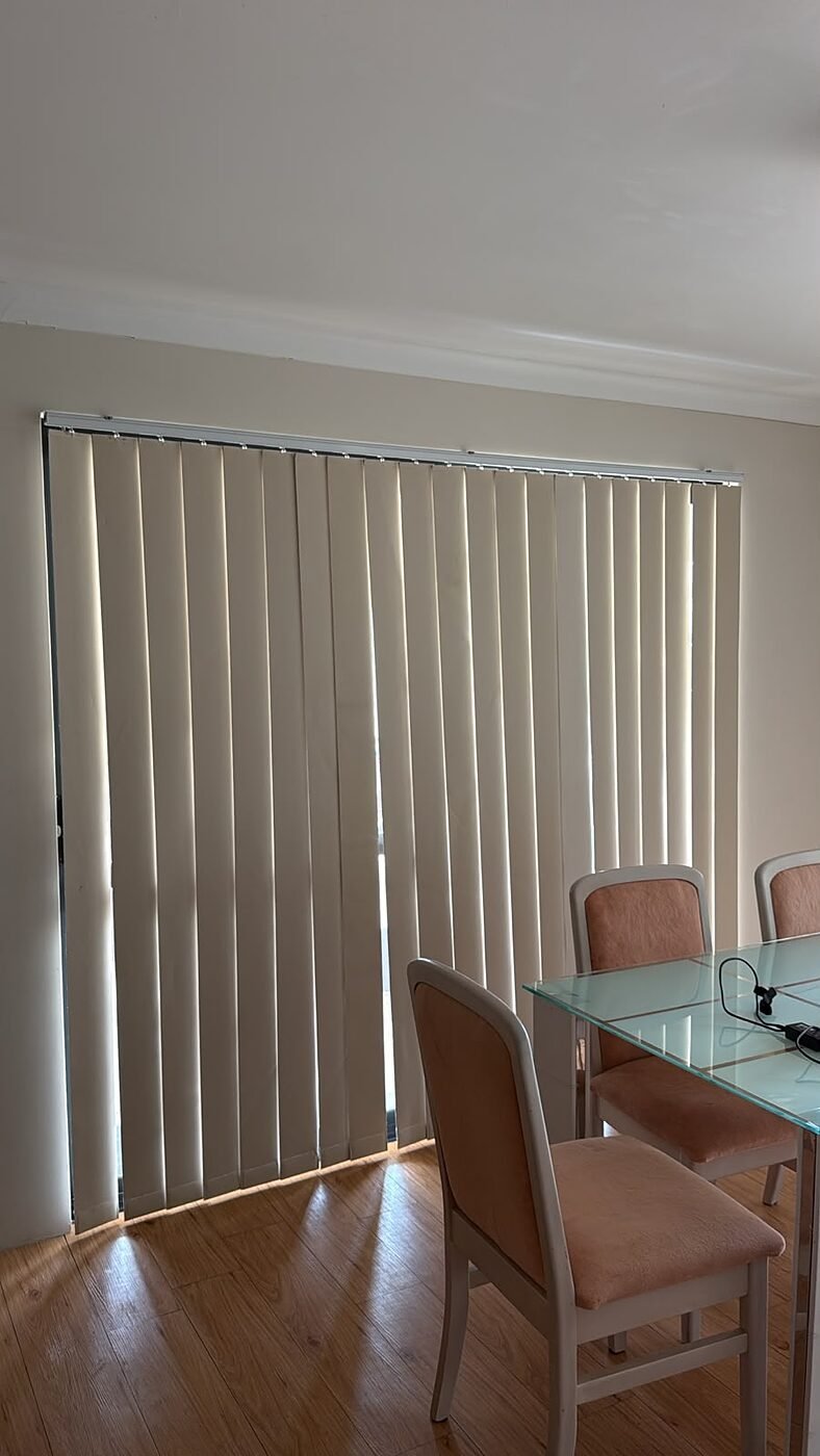 Vertical blinds fitted to a dining room sliding door in a Perth home